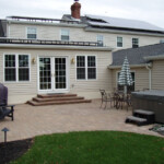 Patio with steps and hot tub